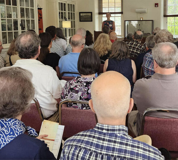 A roomful of seated people attend the LMHS Annual Meeting